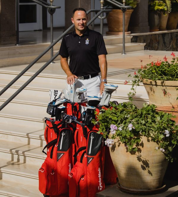 Ivan Kelly delivering golf clubs at a hotel